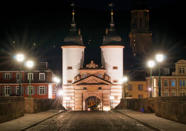 istock the old bridge gate in the old town at night 1297083639