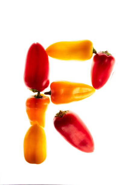 istock Peppers of different colors in white background 1297084572