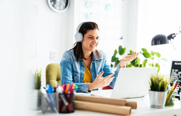 istock Businesswoman working on laptop, having presentation on virtual online event 1297085794