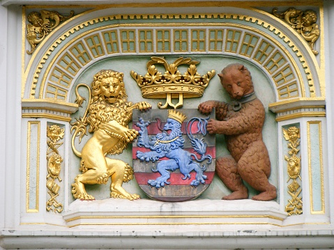 Coat of arms at the town hall, heraldic lion and bear