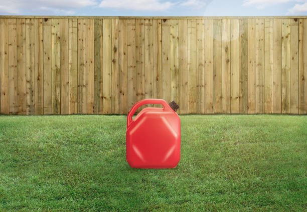 Red fuel & gas tank in a backyard
