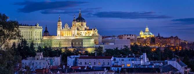 Image of Madrid skyline with Santa Maria la Real de La Almudena Cathedral and the Royal Palace at dusk