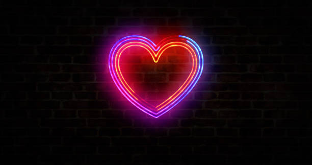 istock Heart and love symbol neon on brick wall 1297090400