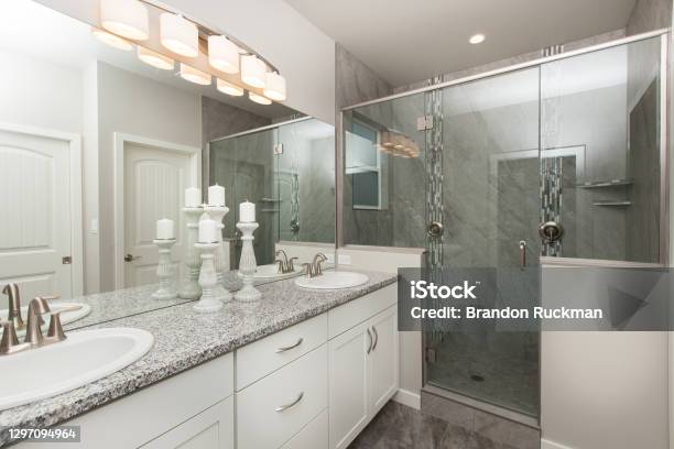 Modern Master Bathroom With White Cabinets With Grey Granite Countertop With Walk In Shower Home Interior Real Estate Listing Stock Photo - Download Image Now