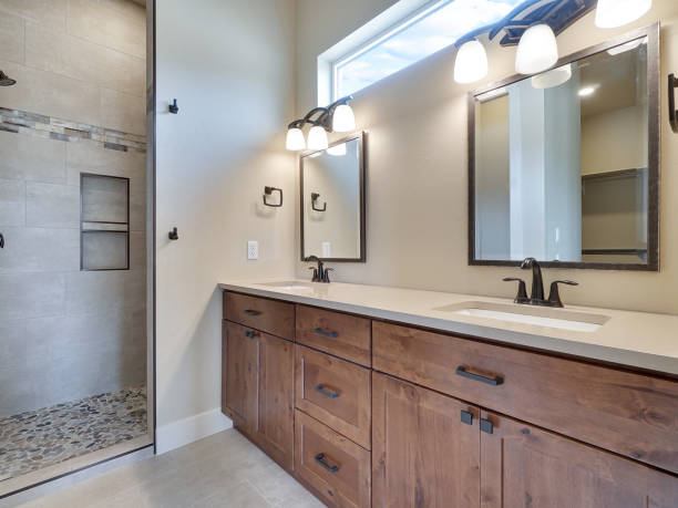 Modern Master Bathroom Grey Walls Brown Cabinets Home Interior Real Estate Listing stock photo