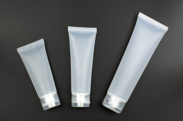 istock White tube for cream on a black background 1297096519
