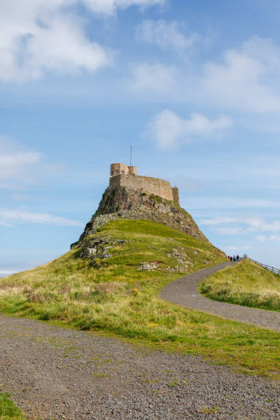 holy island castle in northumberland - northumberland england lindisfarne northeastern england england stock-fotos und bilder