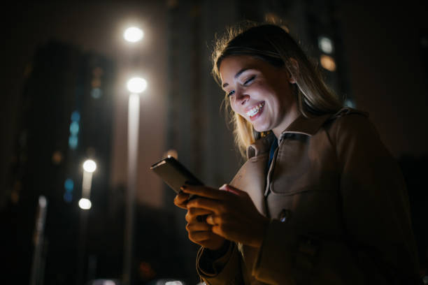 istock Female outdoors, checking social media 1297097578