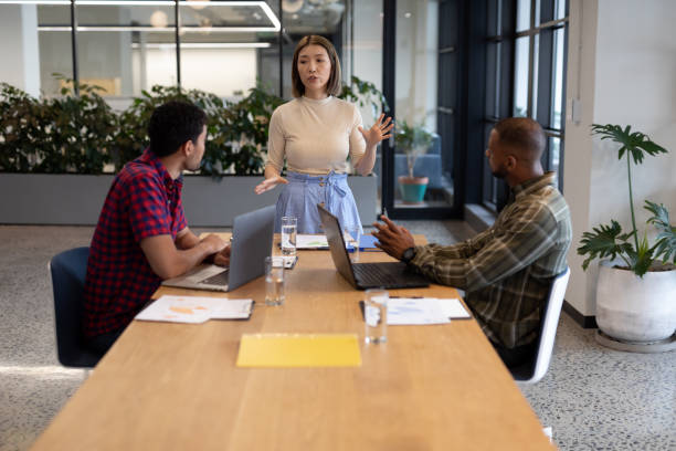istock Diverse group of business people working in creative office 1297098521