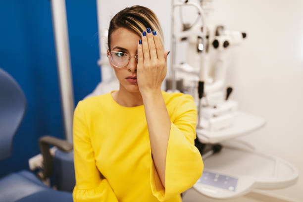 istock Beautiful young woman at ophthalmologist 1297104905