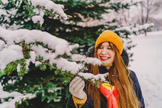 istock Young woman enjoying in the snow 1297105026