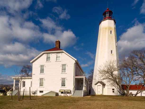 View of the historic Sandy Hook Light, it is the oldest working lighthouse in the United States. It was designed and built on June 11, 1764 by Isaac Conro Sandy Hook, NJ - USA - Jan. 17, 2021: View of the historic Sandy Hook Light, it is the oldest working lighthouse in the United States. It was designed and built on June 11, 1764 by Isaac Conro nike air photos stock pictures, royalty-free photos & images