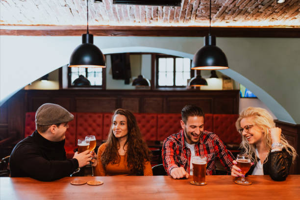 istock Cheers celebration toast with pints of beer 1297106353