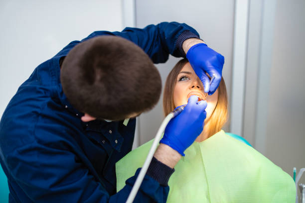 istock Young woman having dental exam 1297107172