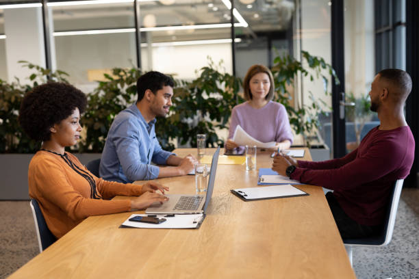 istock Diverse group of business people working in creative office 1297108959