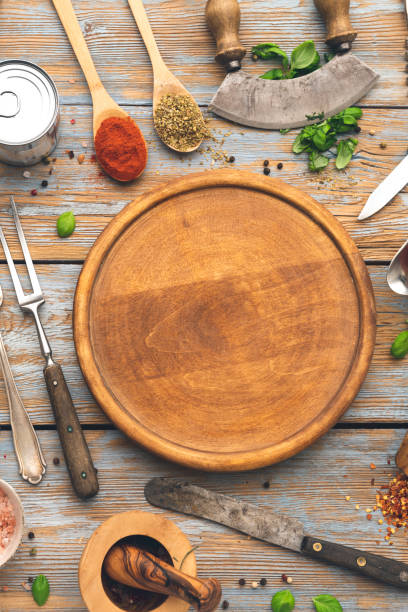 istock Round wooden pizza board 1297109096