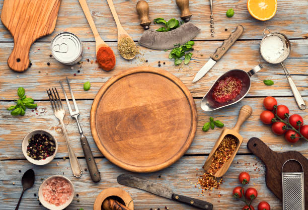 istock Round wooden board with ingredients 1297109104