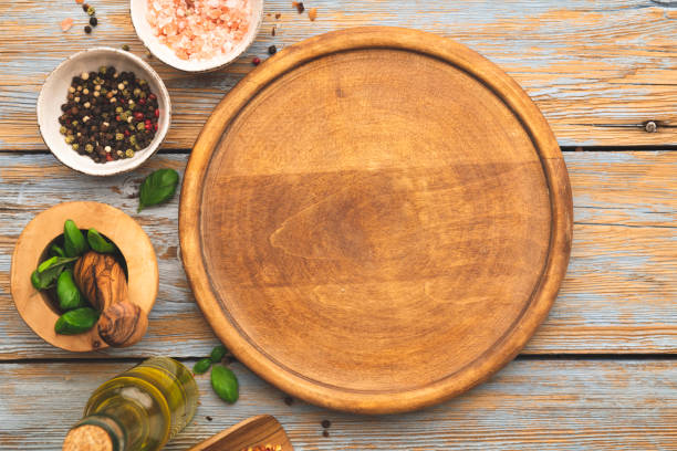 istock Round wooden pizza board 1297109140