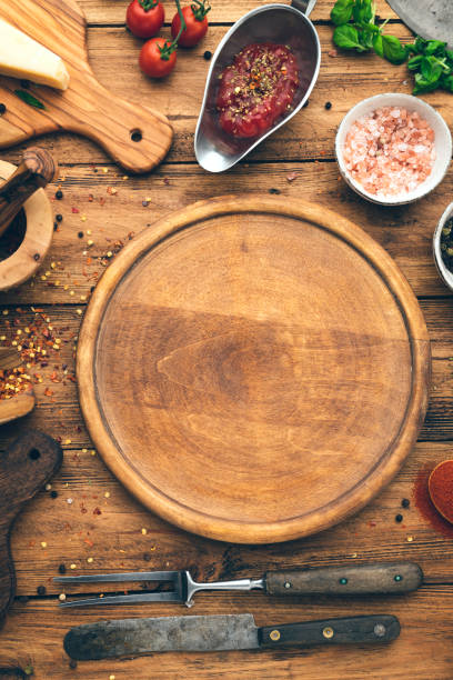 istock Round wooden pizza board 1297109155