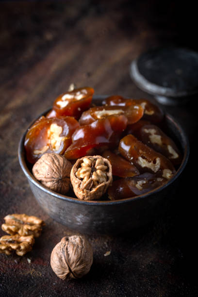 istock Churchkhela Pestil or Walnut Fruit Pulp in bowl on dark background. 1297109510