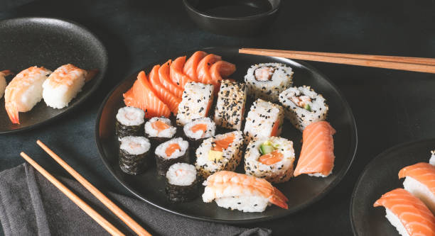 istock Set of sushi and rolls with salmon and shrimp 1297112659