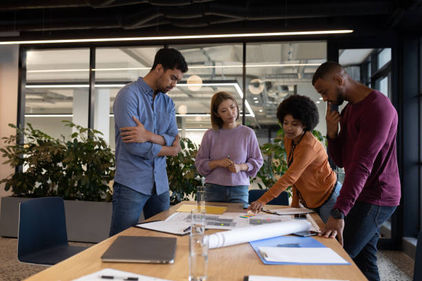 istock Diverse group of business people working in creative office 1297113332