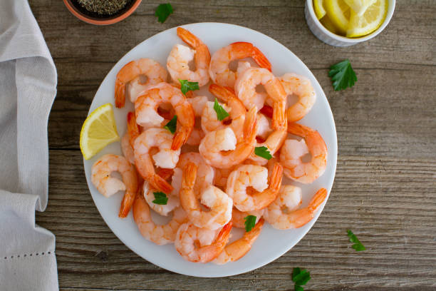 istock Shrimp served with lemon, shot from above. 1297114824