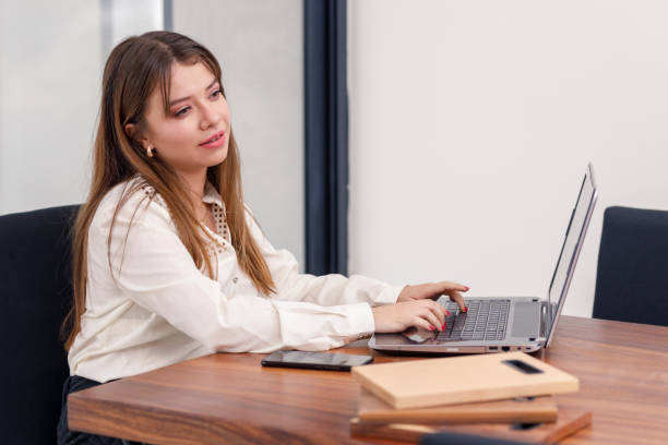 istock Young woman architect working on her house 1297117224