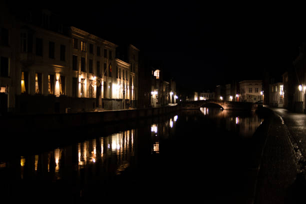 Bruges, Belgium - October 04, 2019: Bridge and building by the river