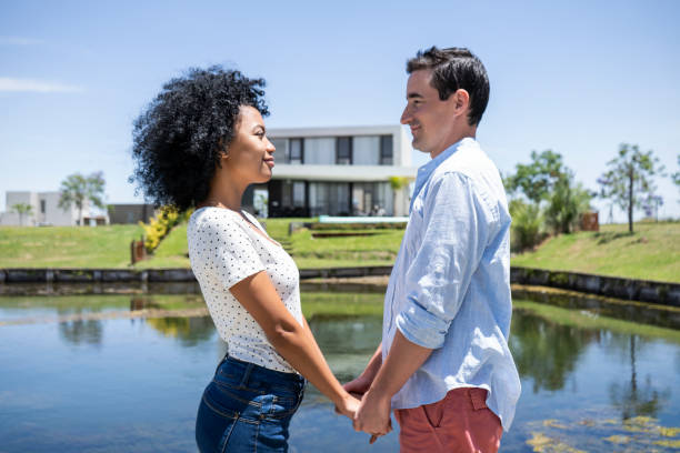 istock Smiling couple looking at each other 1297129000