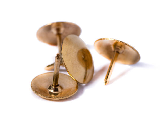 istock Closeup metal tacks isolated on a white. Office concept 1297136137