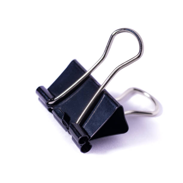 istock Black Paper clip isolated on white background. 1297136153
