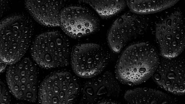istock Black Stones.rock background and water drop 1297145130
