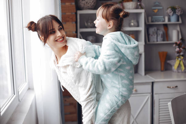 istock Mother with little daughter in a room 1297146836