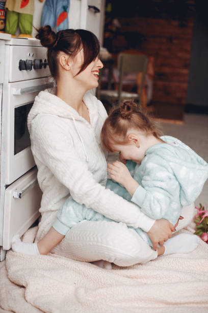 istock Mother with little daughter in a room 1297146883