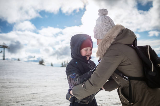 istock Mother and son enjoying in a winter day 1297148784