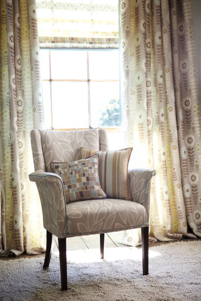 istock Elegant armchair with pillows 1297149751
