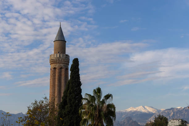 old minaret and cloudy sky