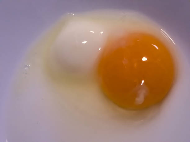 istock Strange egg with an orange and a white yolk 1297151561