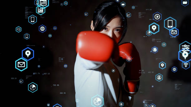 défi du concept d’entreprise. pouvoir des affaires. femme asiatique poinçonnant avec des gants de boxe. - women business strength boxing photos et images de collection