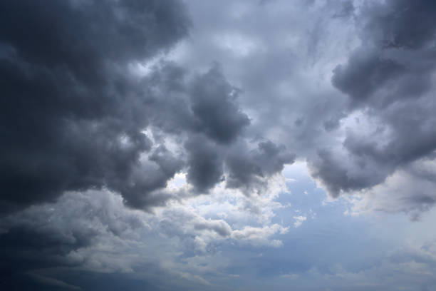 istock dark storm clouds on sky at evening background 1297152505