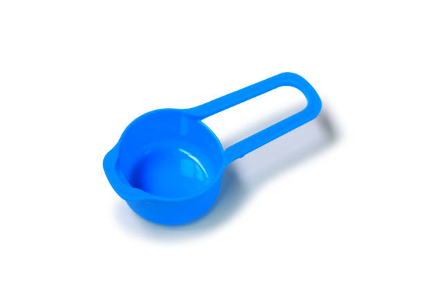 istock Blue measuring cup isolated on white background. 1297152553