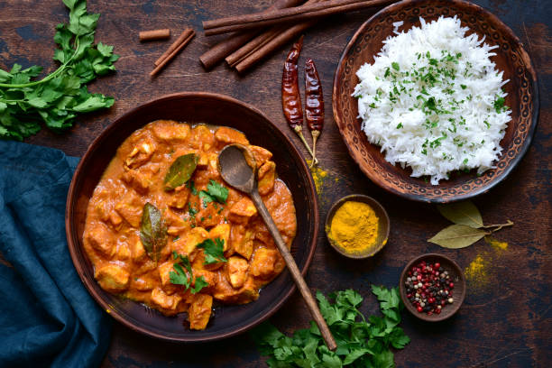 istock Spicy chicken tikka masala with boiled rice 1297152684