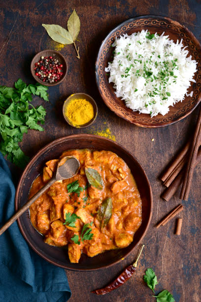 istock Spicy chicken tikka masala with boiled rice 1297152721
