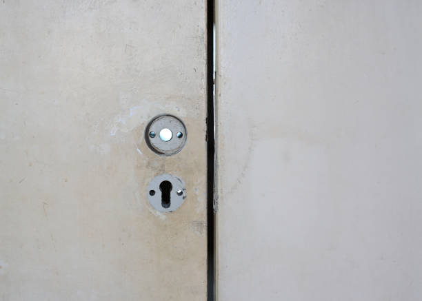 istock Broken metal door knob and key. Waiting  for fix 1297153786