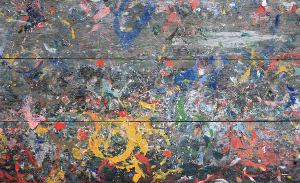istock Splash acrylic color on wood table. Abstract colorful texture background. 1297157779