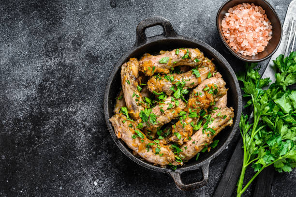 istock Stew with Chicken Neck meat and vegetables. Black background. Top view. Copy space 1297157835