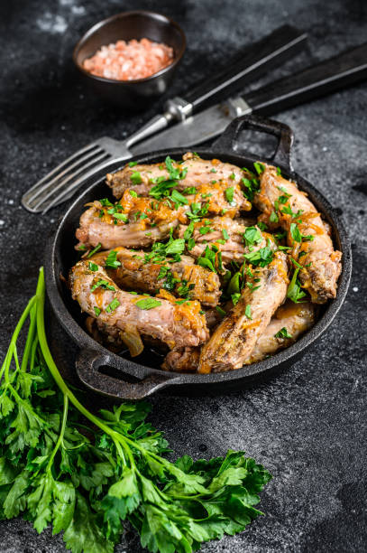 istock Stew with Chicken Neck meat and vegetables. Black background. Top view 1297157852