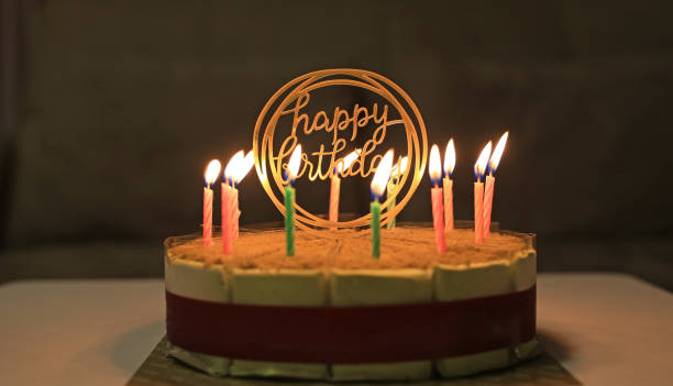 istock Birthday cake with candles on the dark background. 1297158581