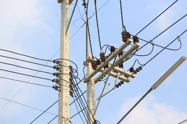 istock Wire electric on concrete pole against cloud sky background. 1297159158